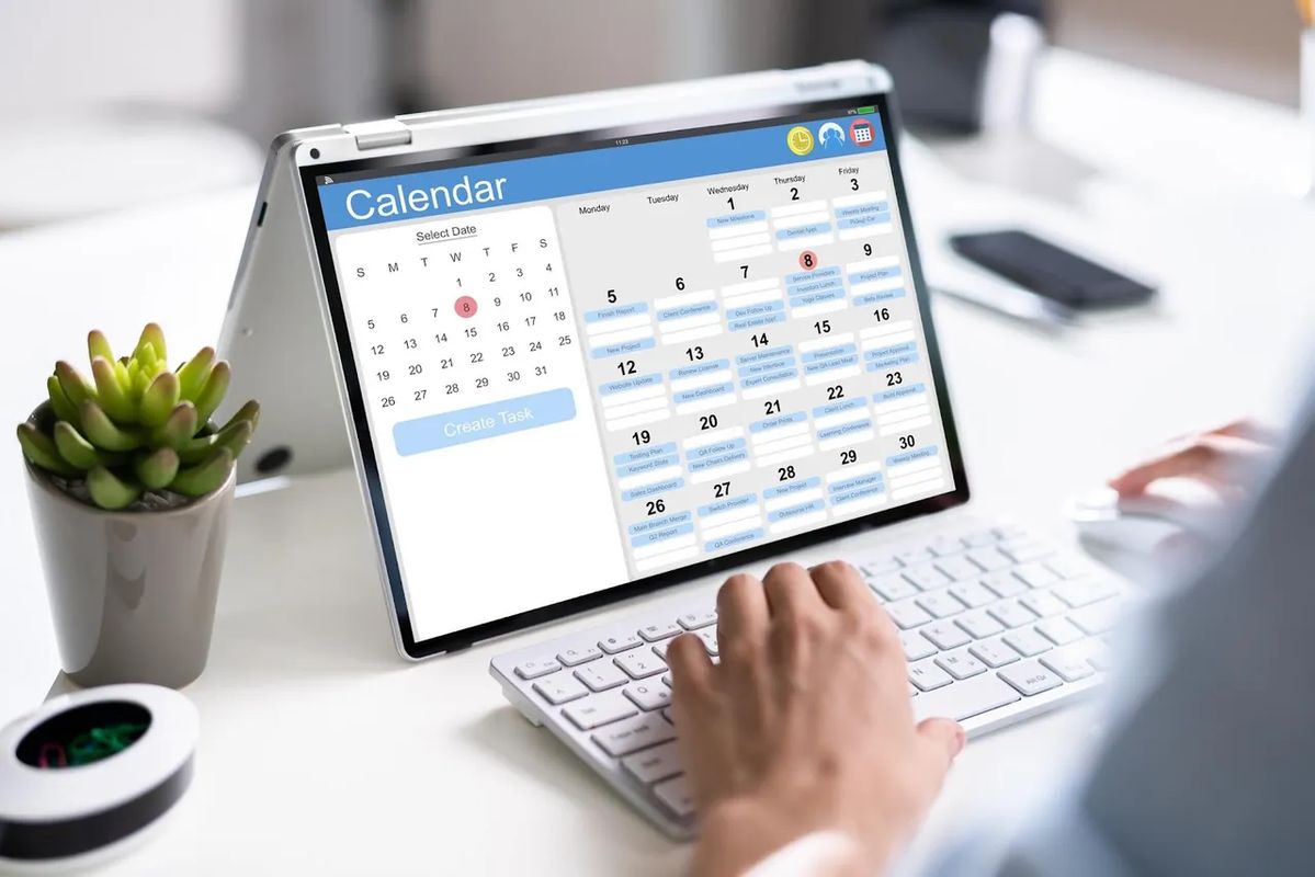 Calendar and laptop showing a planned learning schedule